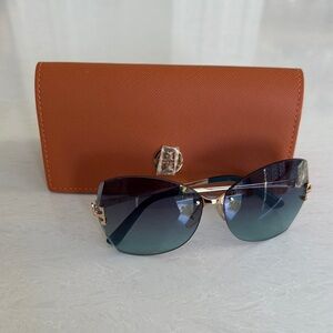 Elegant Gold and Black Sunglasses